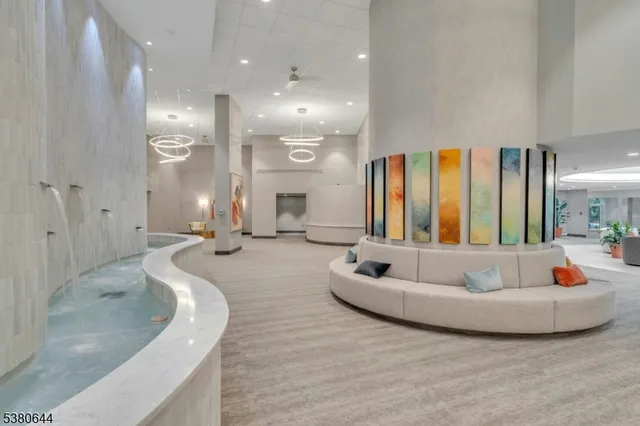 a living room with furniture and a umbrella