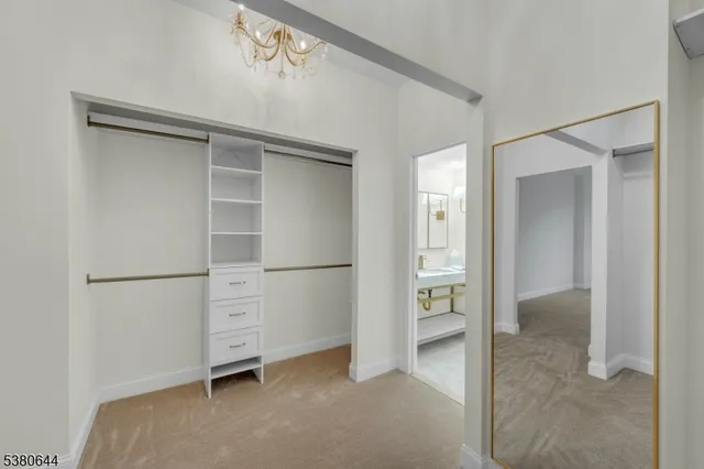 a bathroom with a double vanity sink mirror and shower
