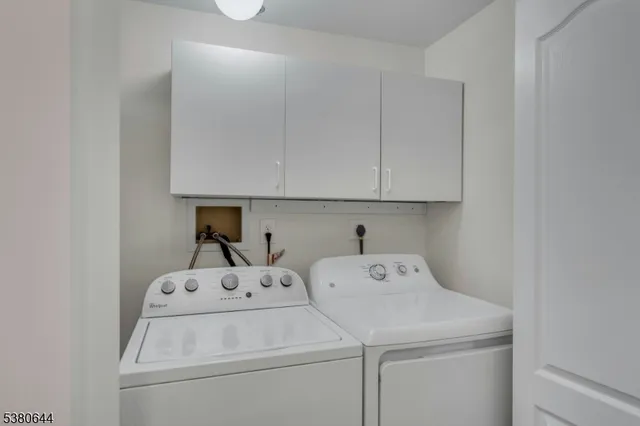 a view of a chair and table in the garden