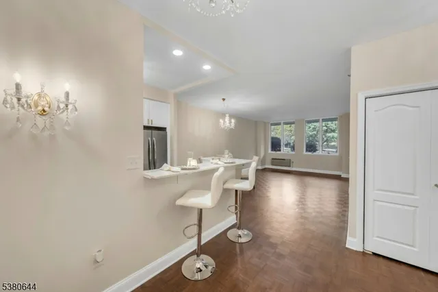 a kitchen with a sink cabinets and refrigerator