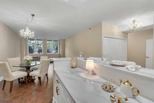 a kitchen with stainless steel appliances a sink stove and refrigerator