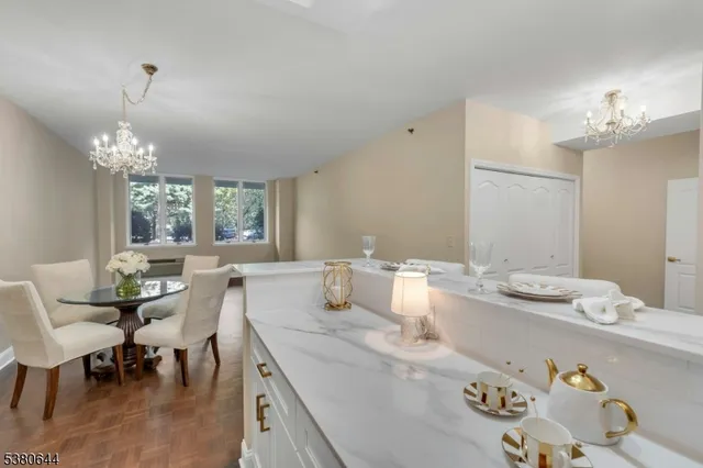 a kitchen with stainless steel appliances a sink stove and refrigerator