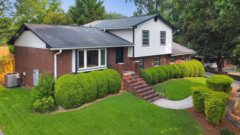 2811 Fern Valley Road Marietta, GA 30066 - Photo 1 of 1 a aerial view of a house with a yard and plants