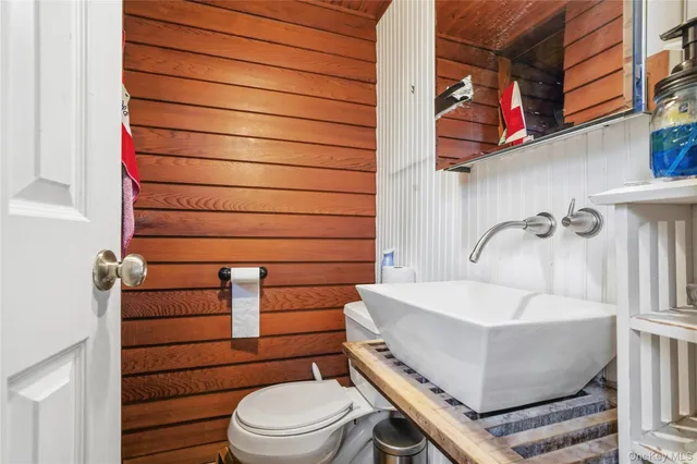 a living room with furniture and a book shelf