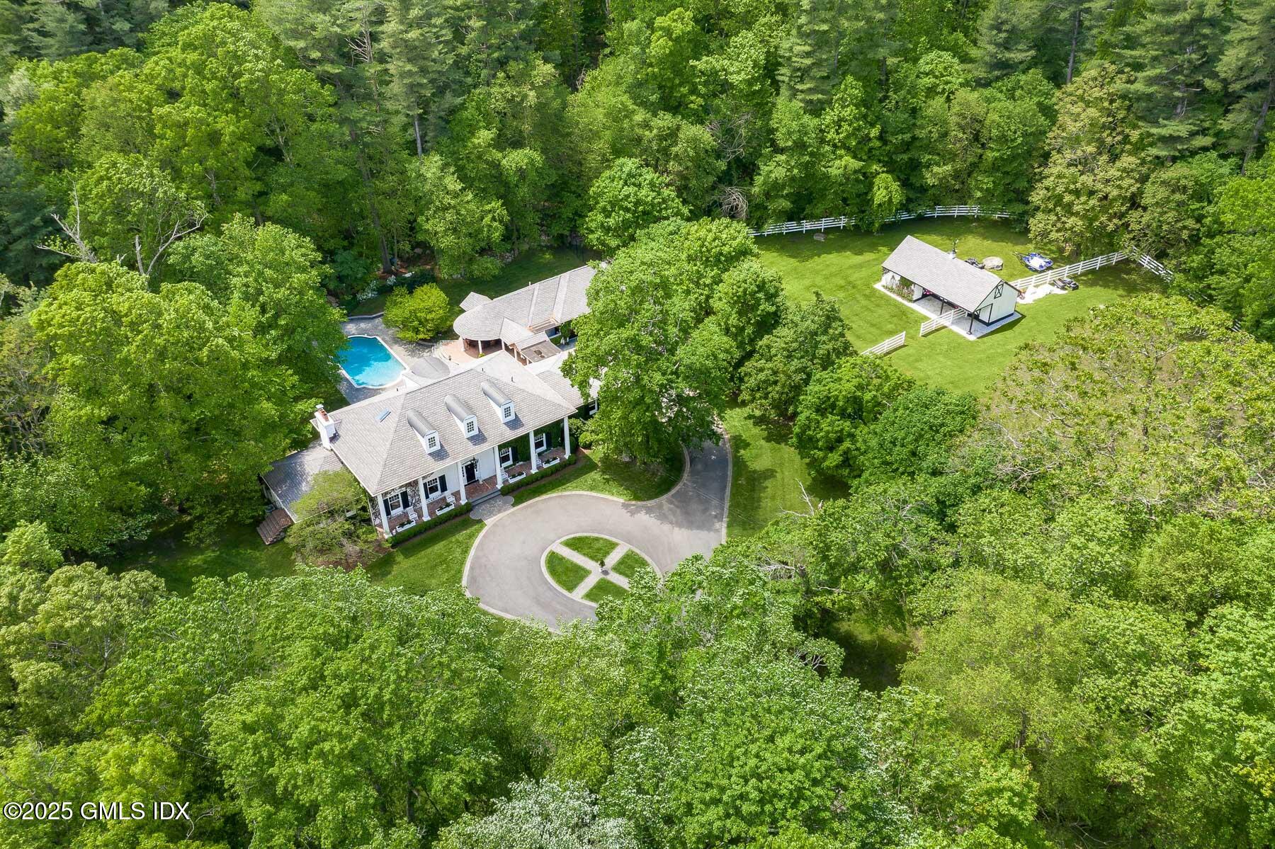 44 North Porchuck Road Greenwich, CT 06831 - Photo 1 of 61 an aerial view of residential house with outdoor space and trees all around