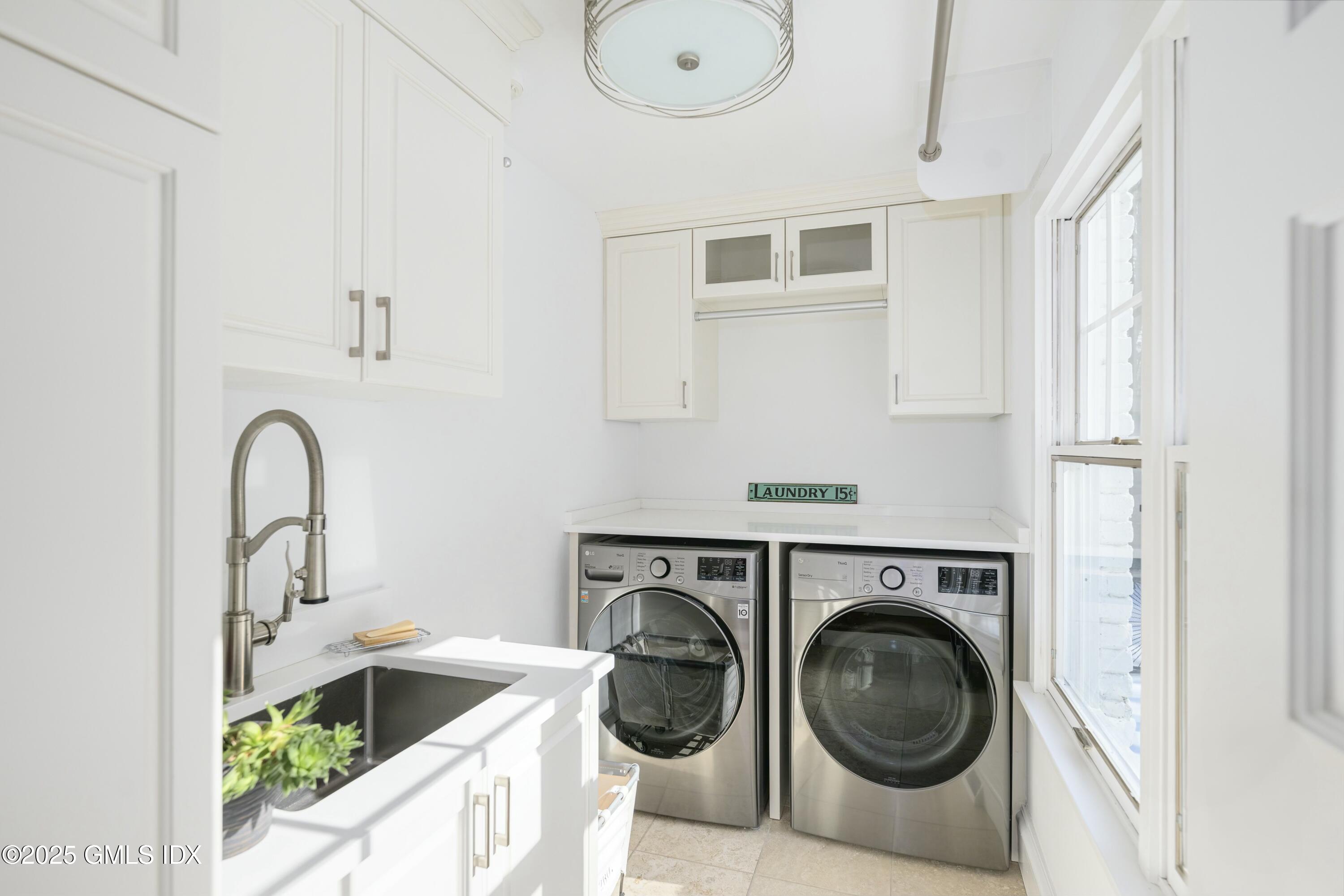 44 North Porchuck Road Greenwich, CT 06831 - Photo 13 of 61 a utility room with sink dryer and washer