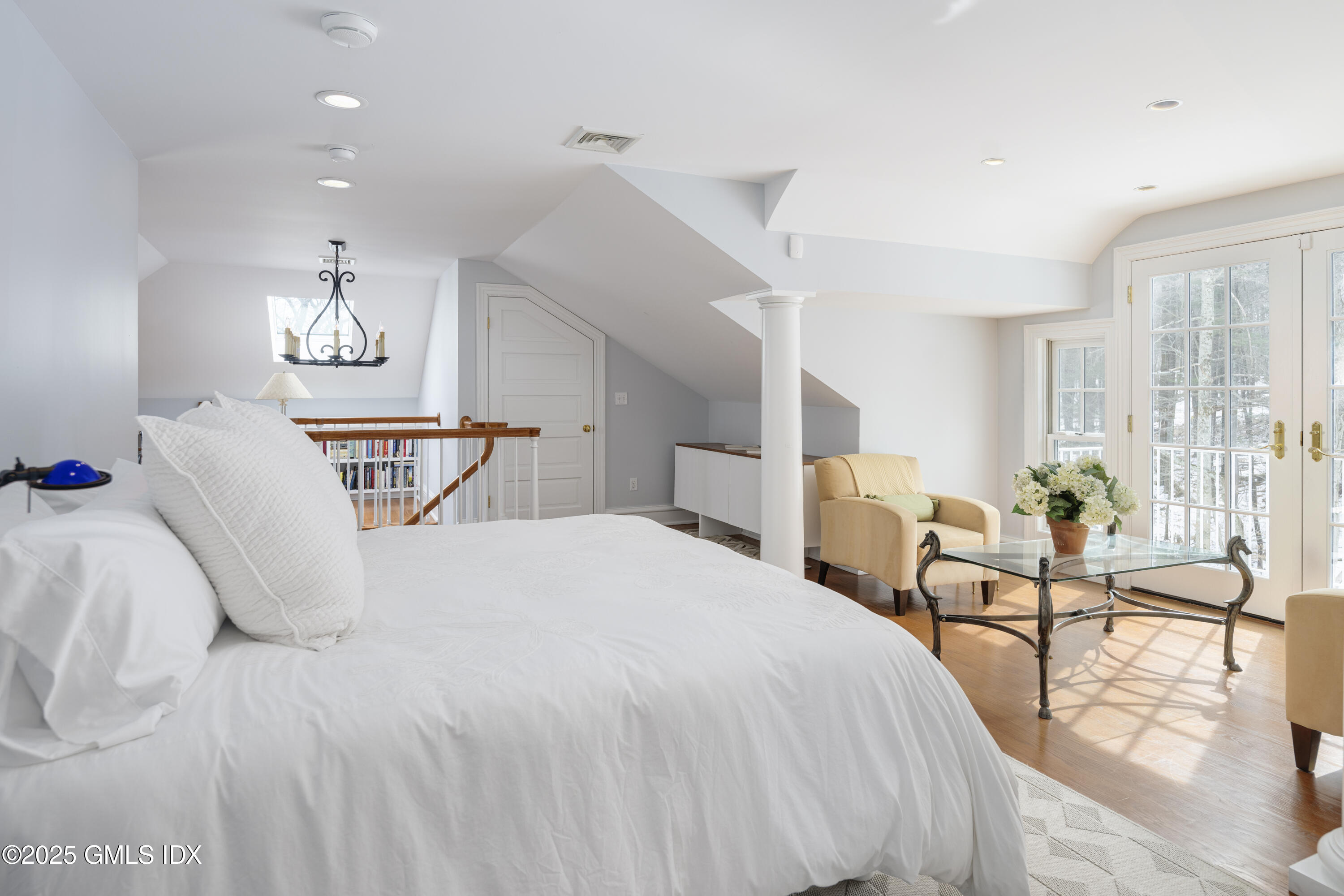 44 North Porchuck Road Greenwich, CT 06831 - Photo 32 of 61 a bedroom with a bed window and a table chair