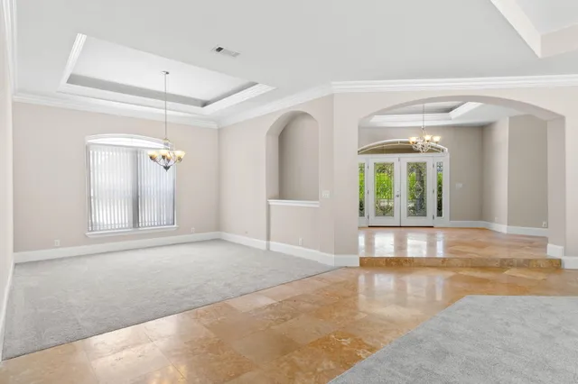 a kitchen with kitchen island a counter top space appliances and a window