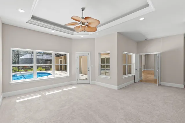 a view of a lake with a floor to ceiling window