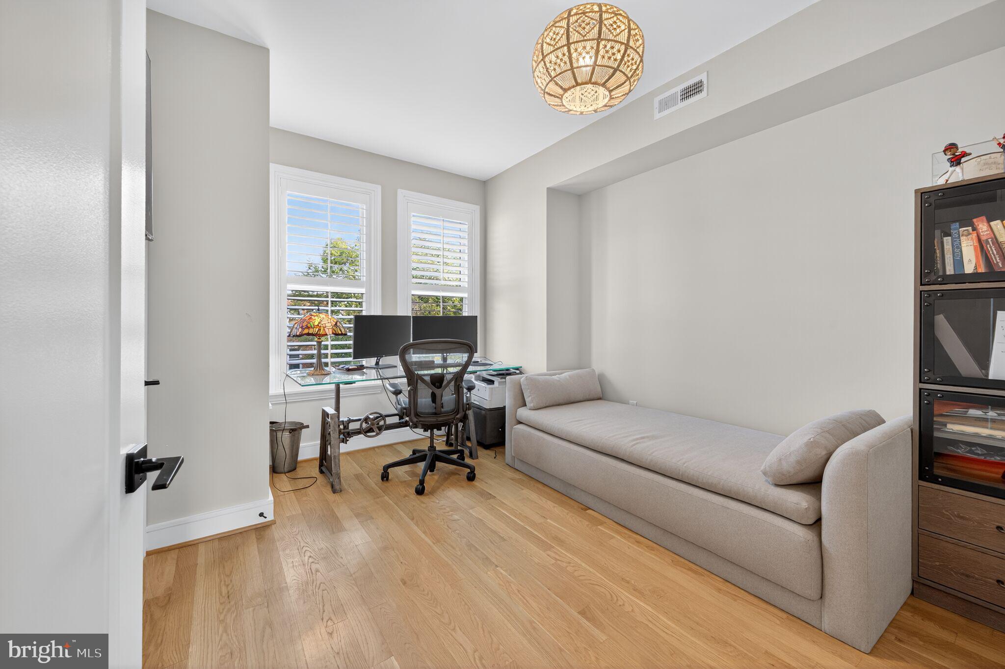 1309 D Street Southeast Washington, DC 20003 - Photo 19 of 38 a living room with furniture a rug and a window