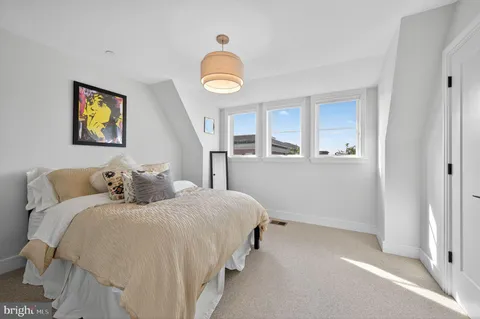 a bedroom with bed and a window