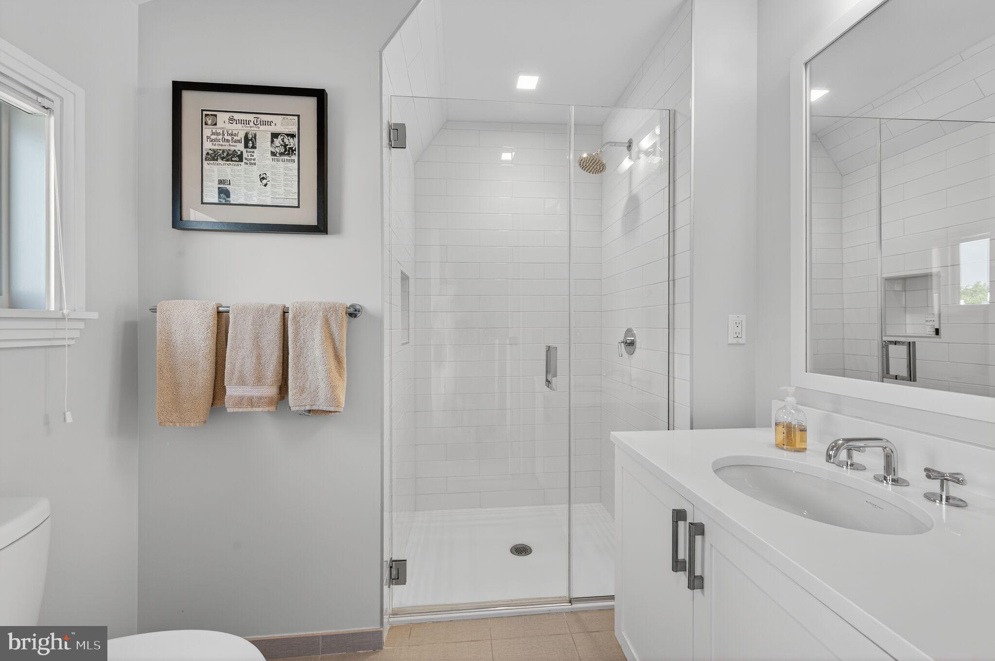 1309 D Street Southeast Washington, DC 20003 - Photo 24 of 38 a bathroom with a sink toilet and shower
