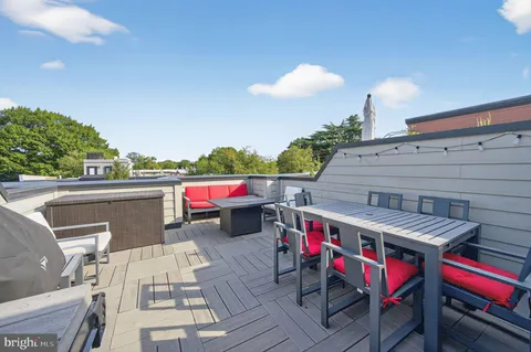 a utility room with a table and chairs