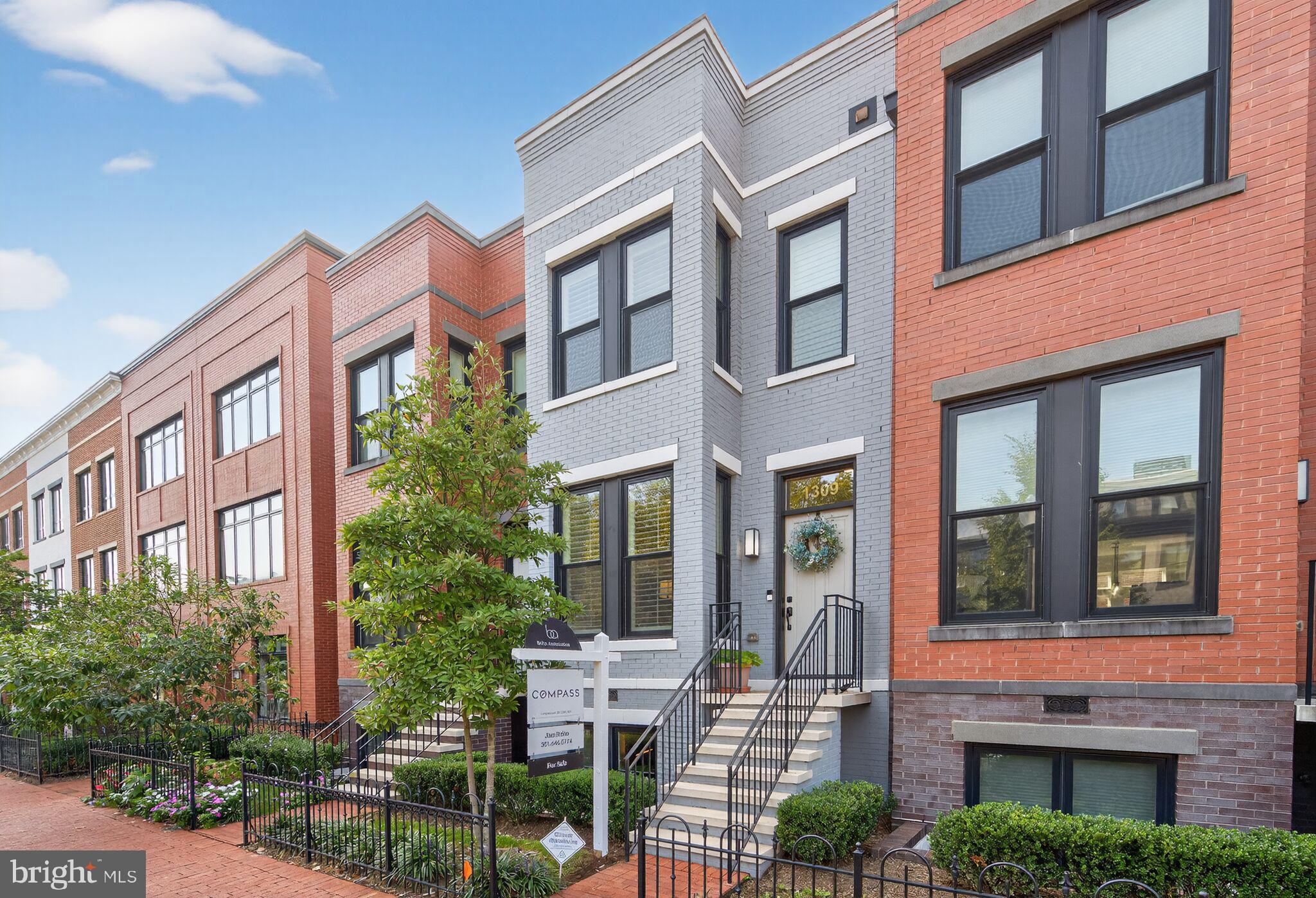 1309 D Street Southeast Washington, DC 20003 - Photo 30 of 38 a view of a brick building next to a yard