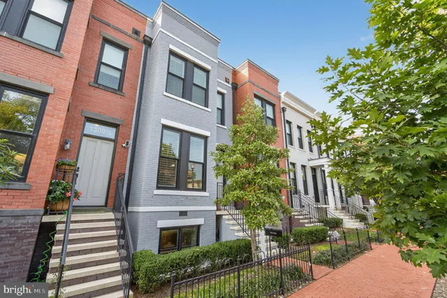 a front view of a multi story residential apartment building