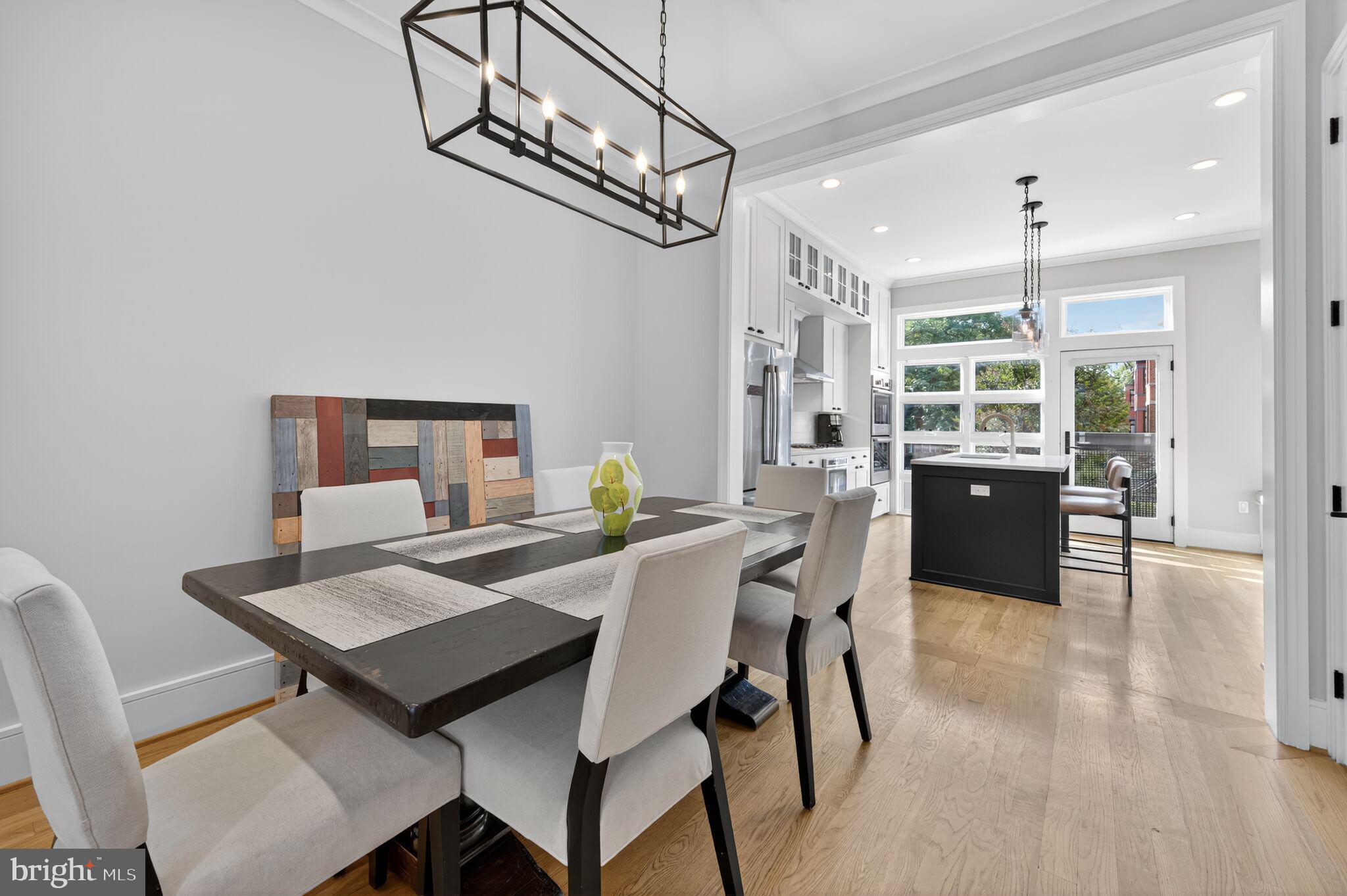 1309 D Street Southeast Washington, DC 20003 - Photo 6 of 38 a view of a dining room with furniture and wooden floor