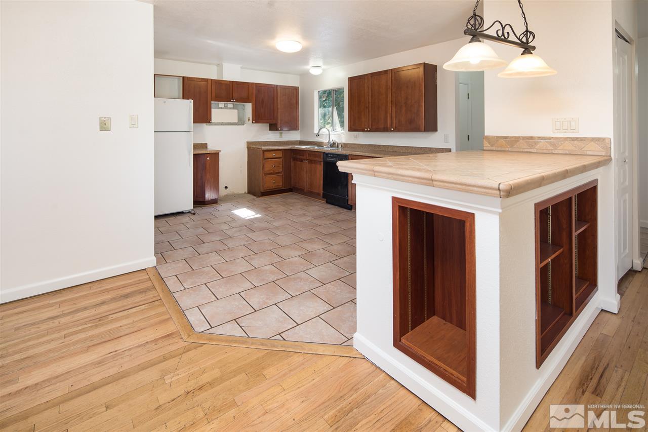 3301 Bryan Street Reno, NV 89503 - Photo 3 of 25 a view of kitchen with granite countertop cabinets and outdoor space
