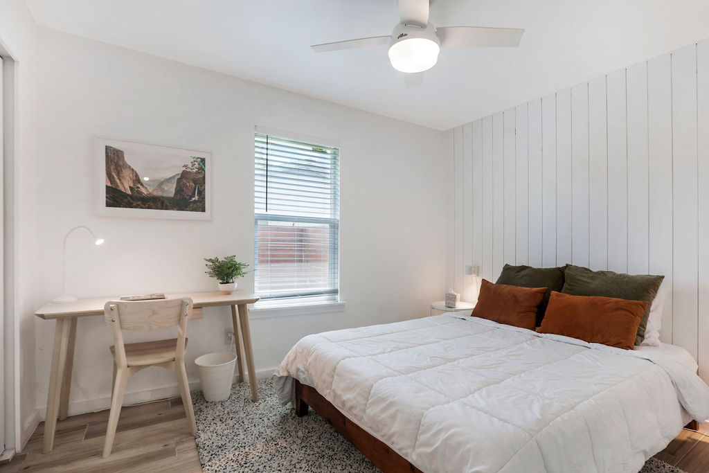 906 East Leslie Circle, Unit A Austin, TX 78721 - Photo 2 of 16 a bedroom with a bed and a window