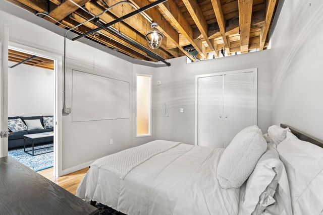 a bedroom with a bed and a walk in closet