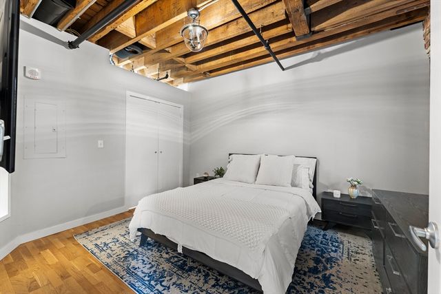 a bedroom with a bed and a dresser