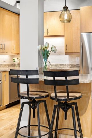 a view of a dining room with furniture and a window