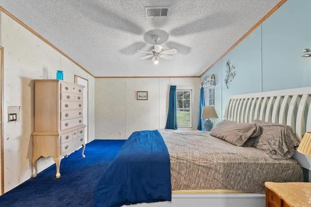 a bedroom with furniture and wooden floor