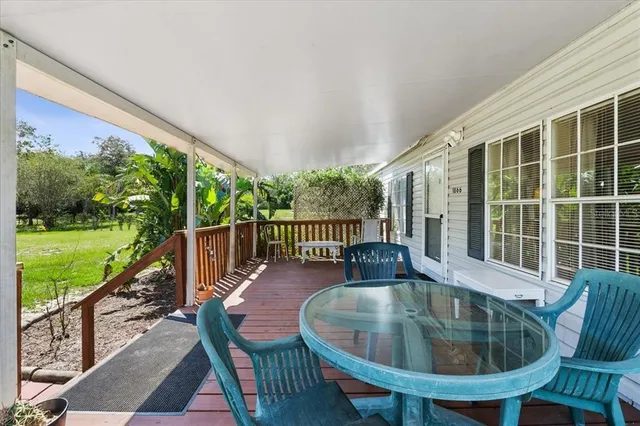 a view of balcony with furniture