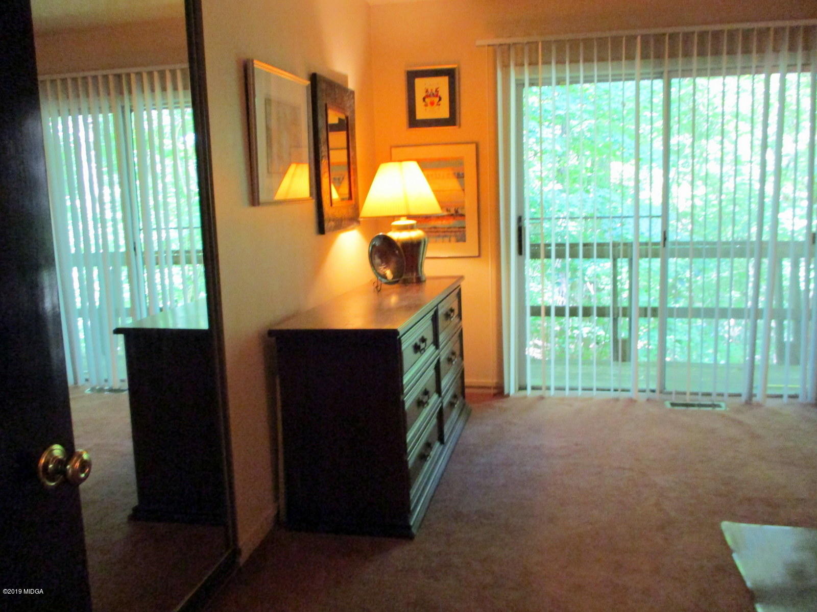1884 Long Ridge Place Macon, GA 31211 - Photo 17 of 32 a view of a room that has a bed and a table in it