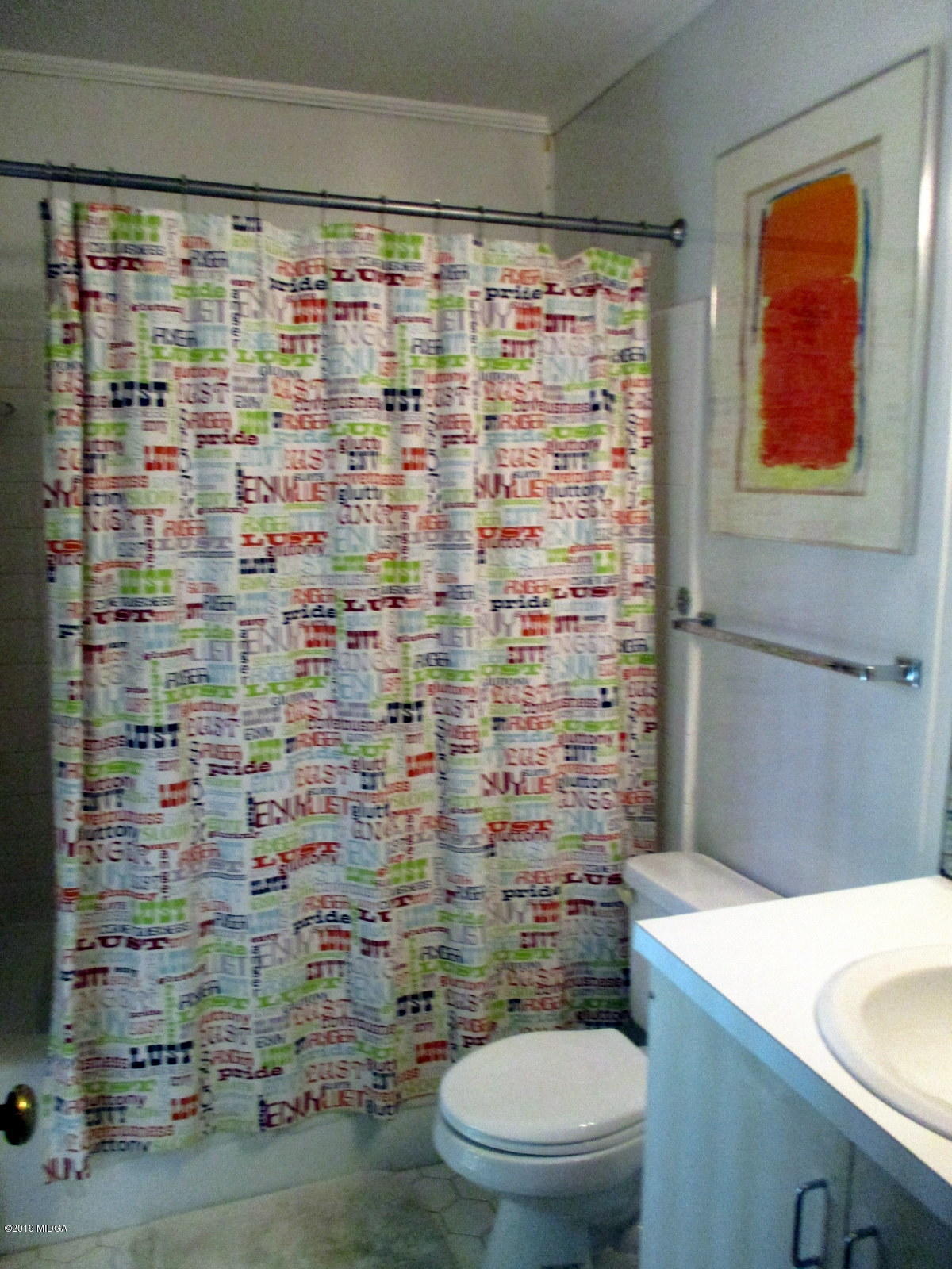 1884 Long Ridge Place Macon, GA 31211 - Photo 19 of 32 a bathroom with a toilet and a shower curtain