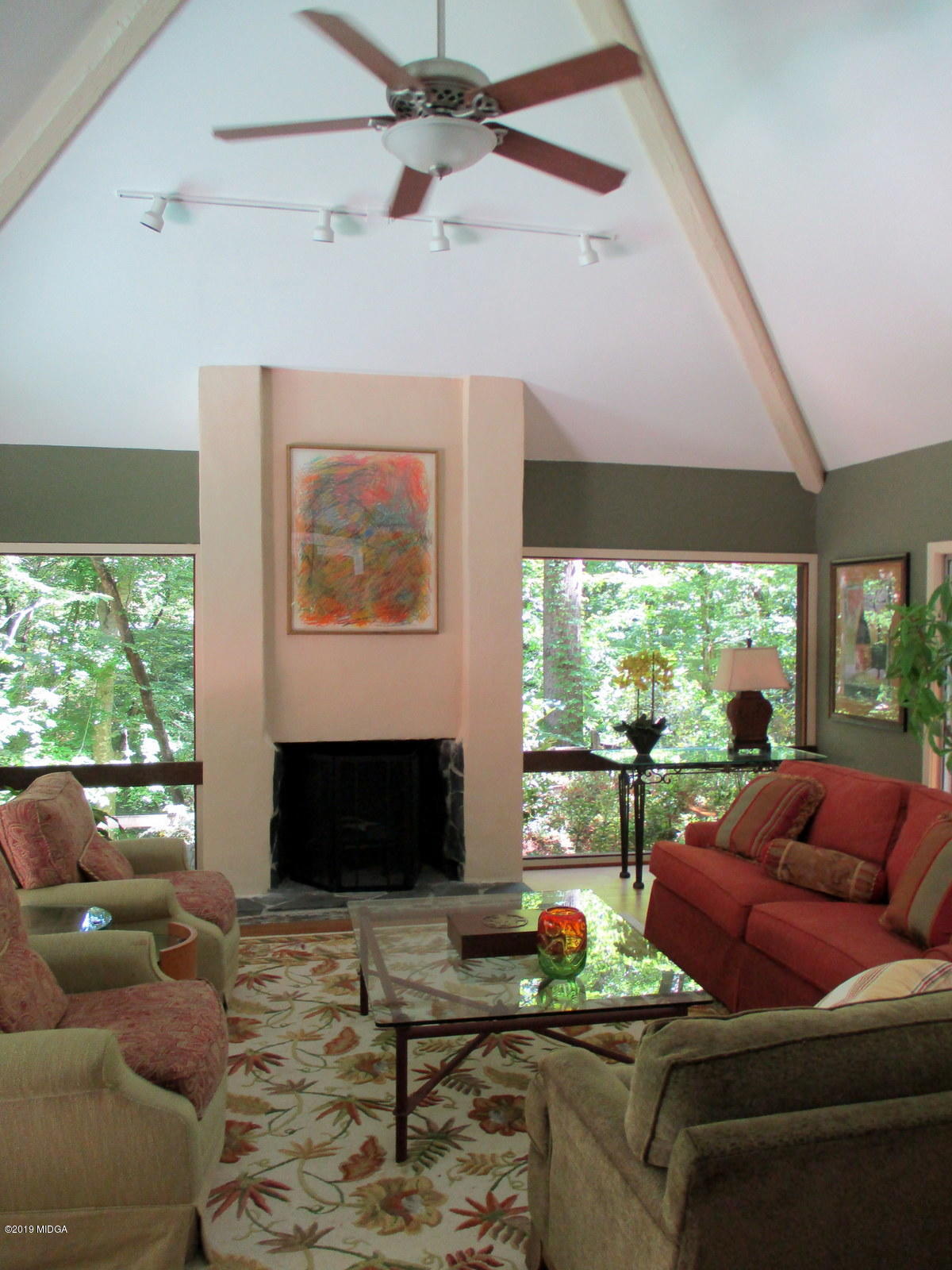 1884 Long Ridge Place Macon, GA 31211 - Photo 3 of 32 a living room with furniture a fireplace and a floor to ceiling window