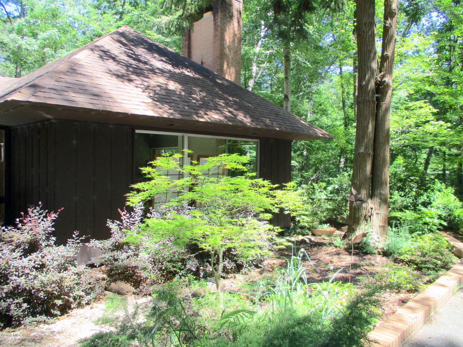 1884 Long Ridge Place Macon, GA 31211 - Photo 29 of 32 a backyard of a house with lots of green space