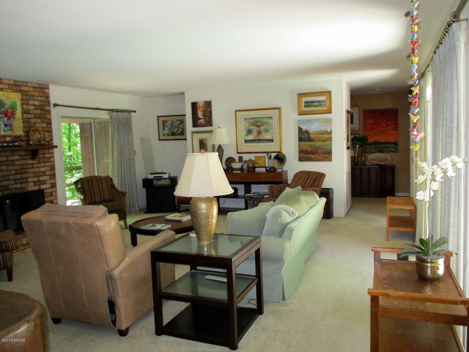 1884 Long Ridge Place Macon, GA 31211 - Photo 10 of 32 a living room with furniture a flat screen tv and a fireplace