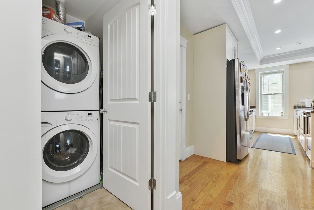 264 Athens Street, Unit 5 Boston, MA 02127 - Photo 13 of 18 a view of a hallway with washer and dryer