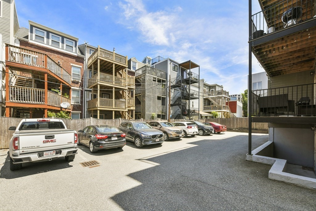 264 Athens Street, Unit 5 Boston, MA 02127 - Photo 16 of 18 a car parked in front of a building