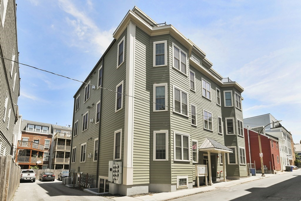 264 Athens Street, Unit 5 Boston, MA 02127 - Photo 17 of 18 a front view of a building with a street