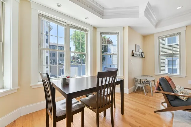 a view of a dining room with furniture window and outside view