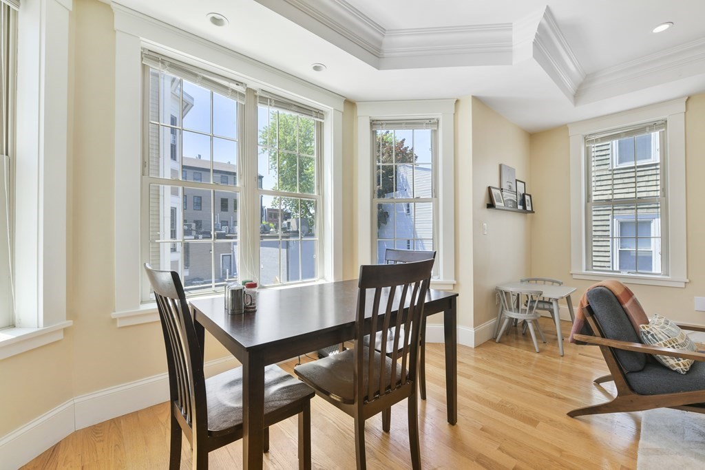 264 Athens Street, Unit 5 Boston, MA 02127 - Photo 8 of 18 a view of a dining room with furniture window and outside view