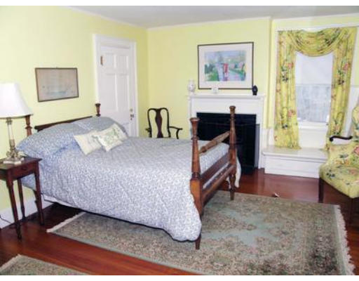 46 Welch Road Brookline, MA 02445 - Photo 12 of 15 a bedroom with a bed and wooden floor