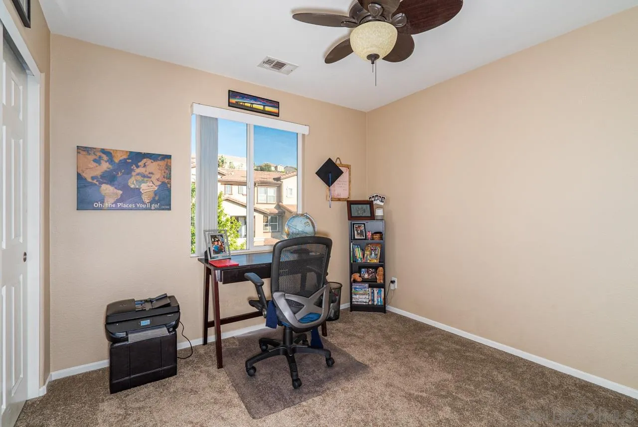 1113 Calabria Street Santee, CA 92071 - Photo 11 of 31 a view of a workspace with furniture and a window
