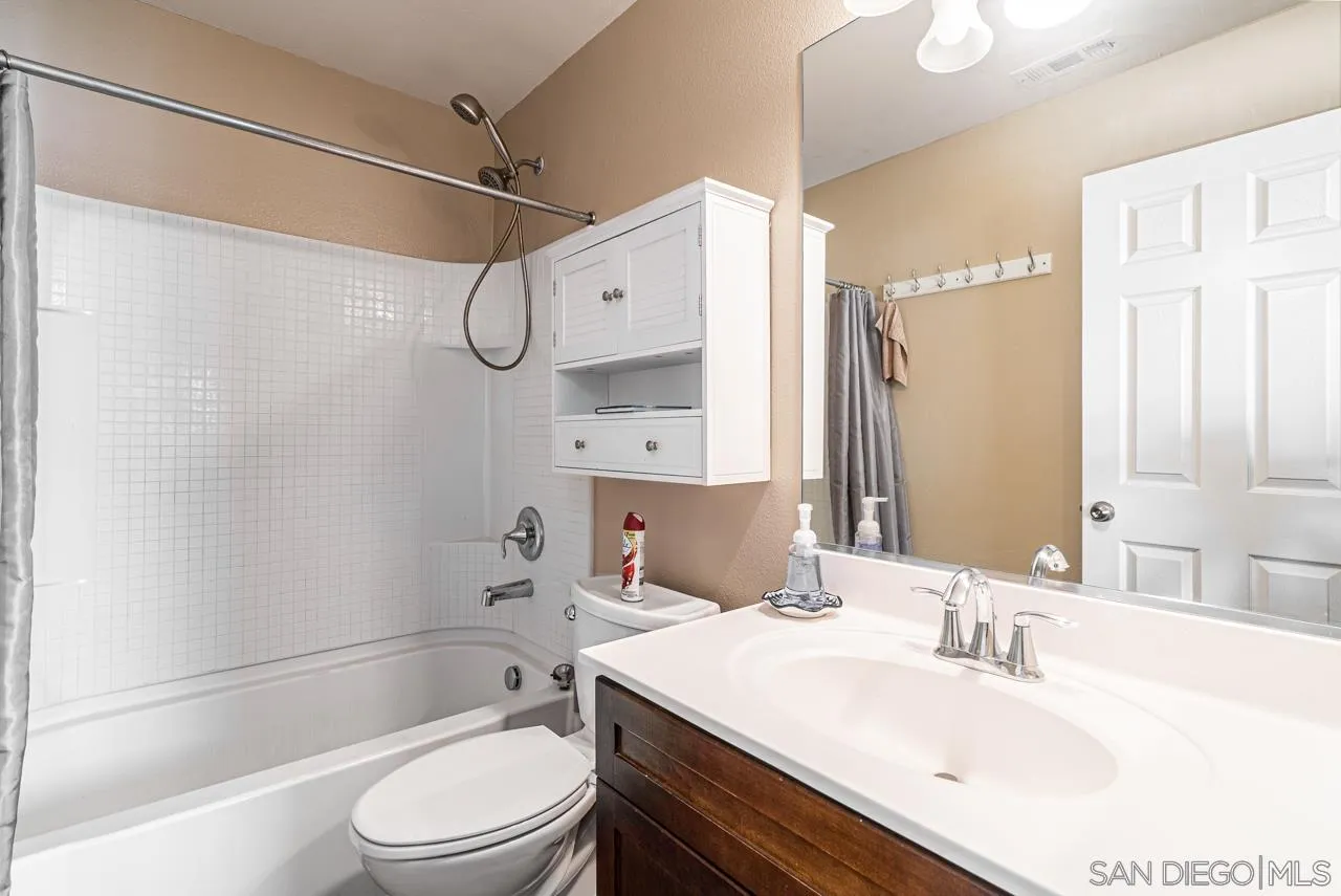 1113 Calabria Street Santee, CA 92071 - Photo 12 of 31 a bathroom with a sink vanity granite toilet tub and shower