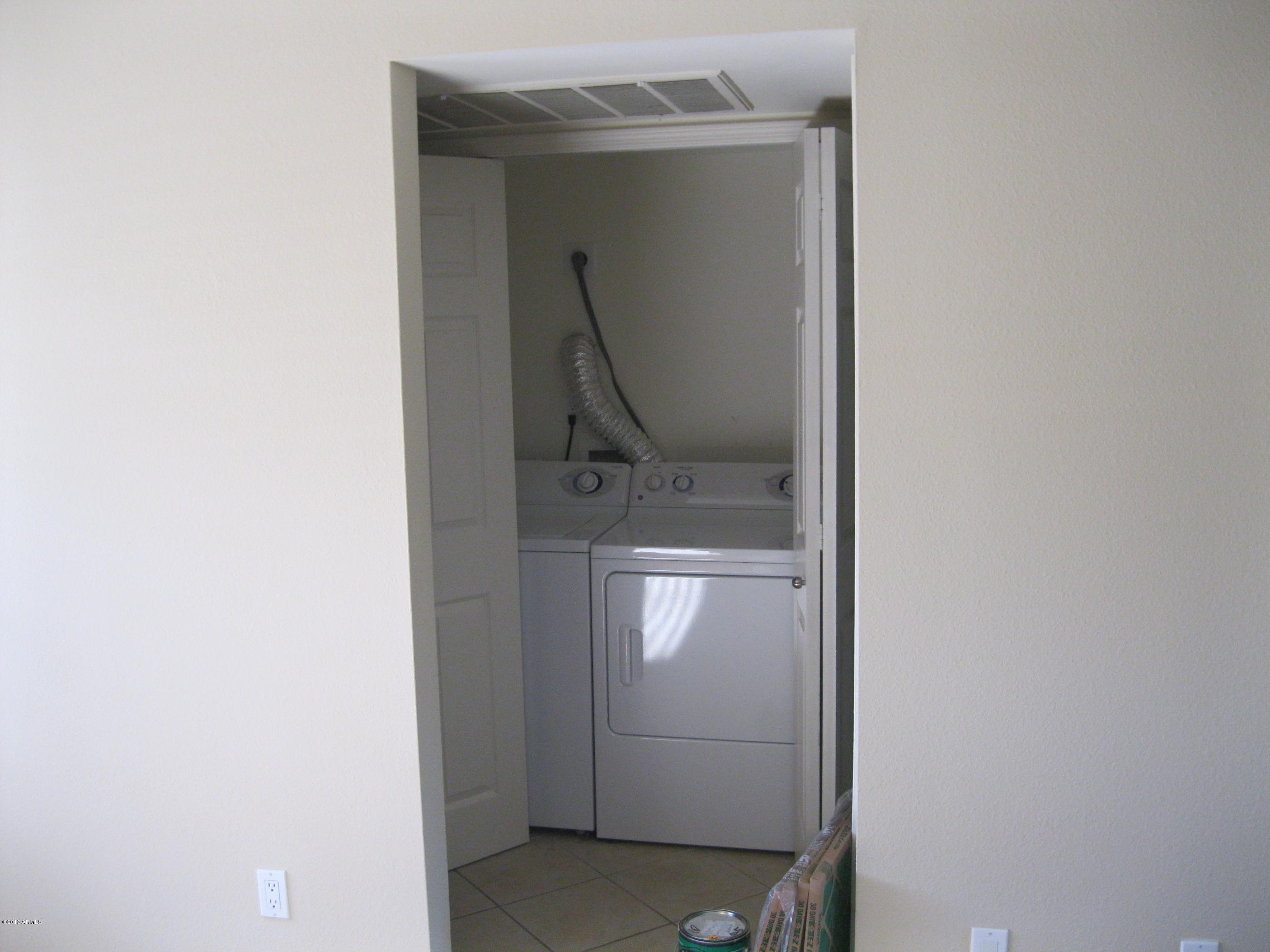2625 East Indian School Road, Unit 229 Phoenix, AZ 85016 - Photo 4 of 11 a utility room with washer and dryer
