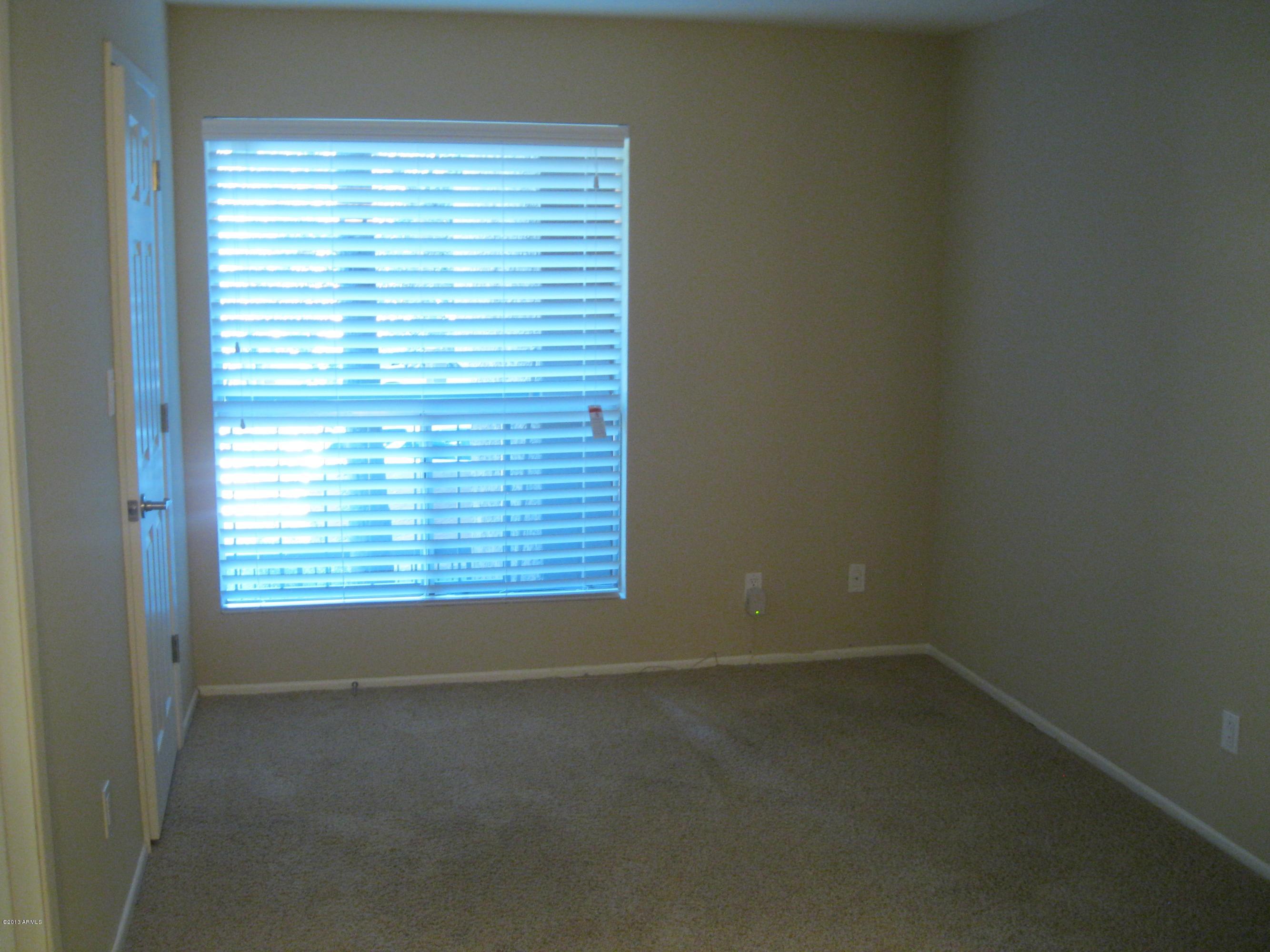 2625 East Indian School Road, Unit 229 Phoenix, AZ 85016 - Photo 6 of 11 a view of an empty room with a window