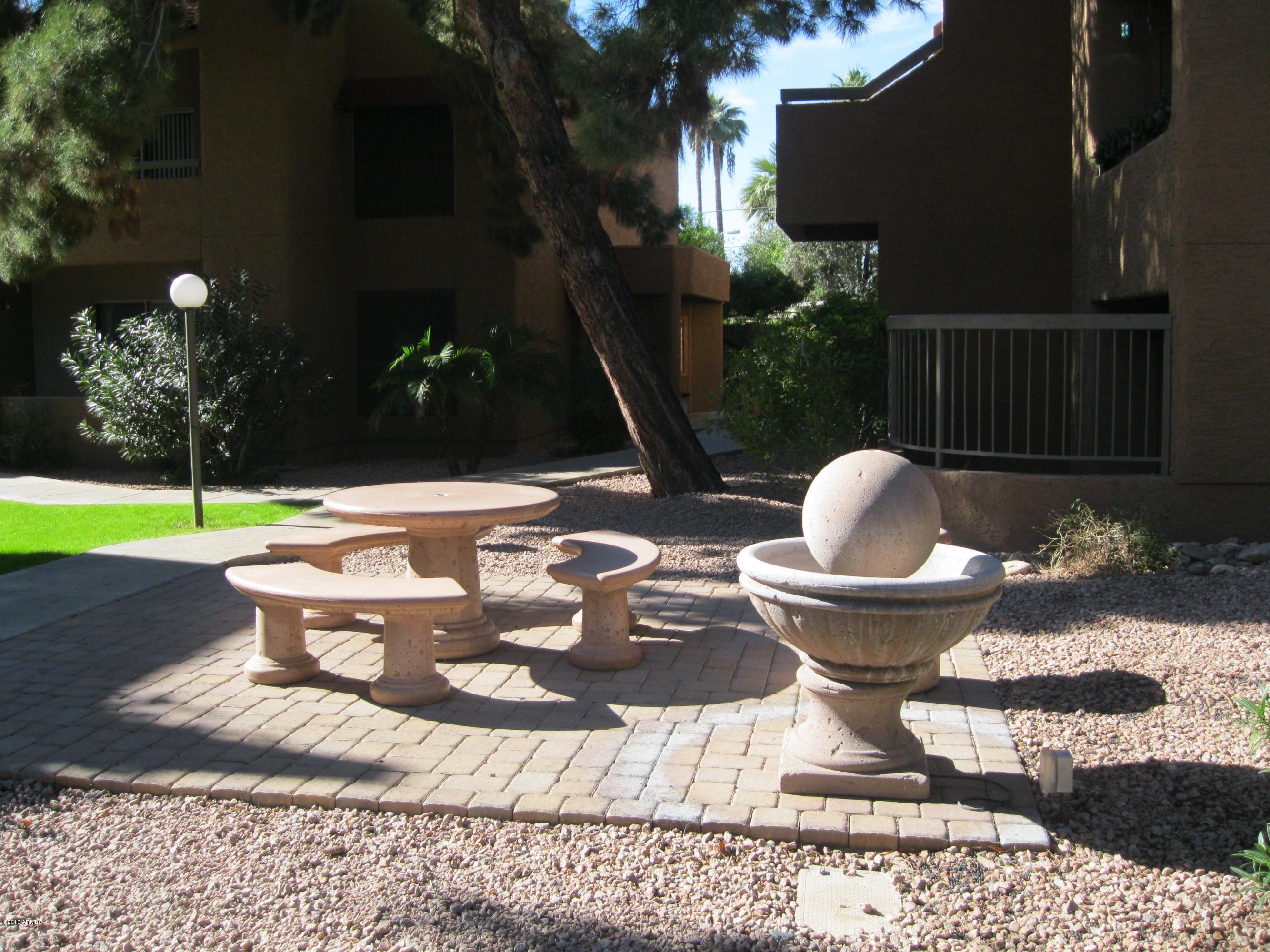 2625 East Indian School Road, Unit 229 Phoenix, AZ 85016 - Photo 10 of 11 a view of a house with backyard and sitting area