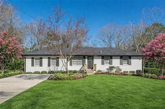 a front view of a house with garden