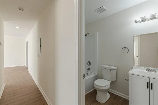 a bathroom with a toilet sink and a shower