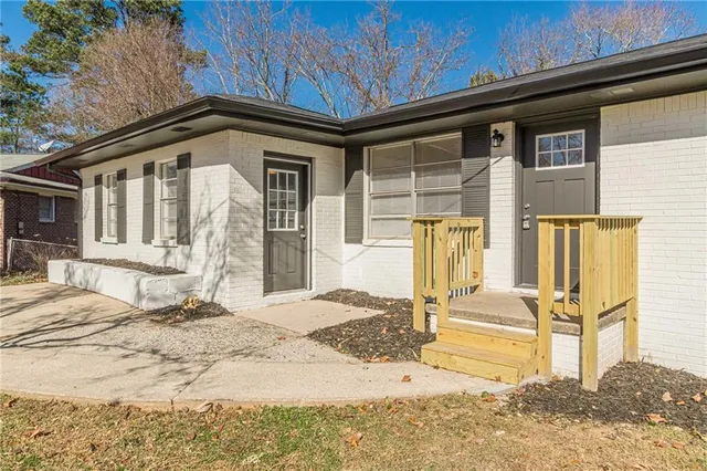 a front view of a house with a outdoor space