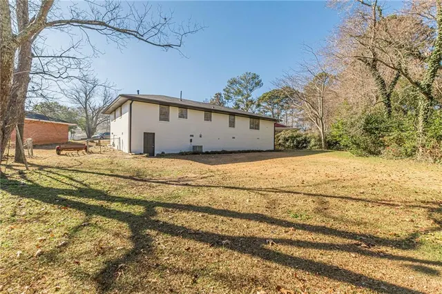a view of a house with a snow in the yard