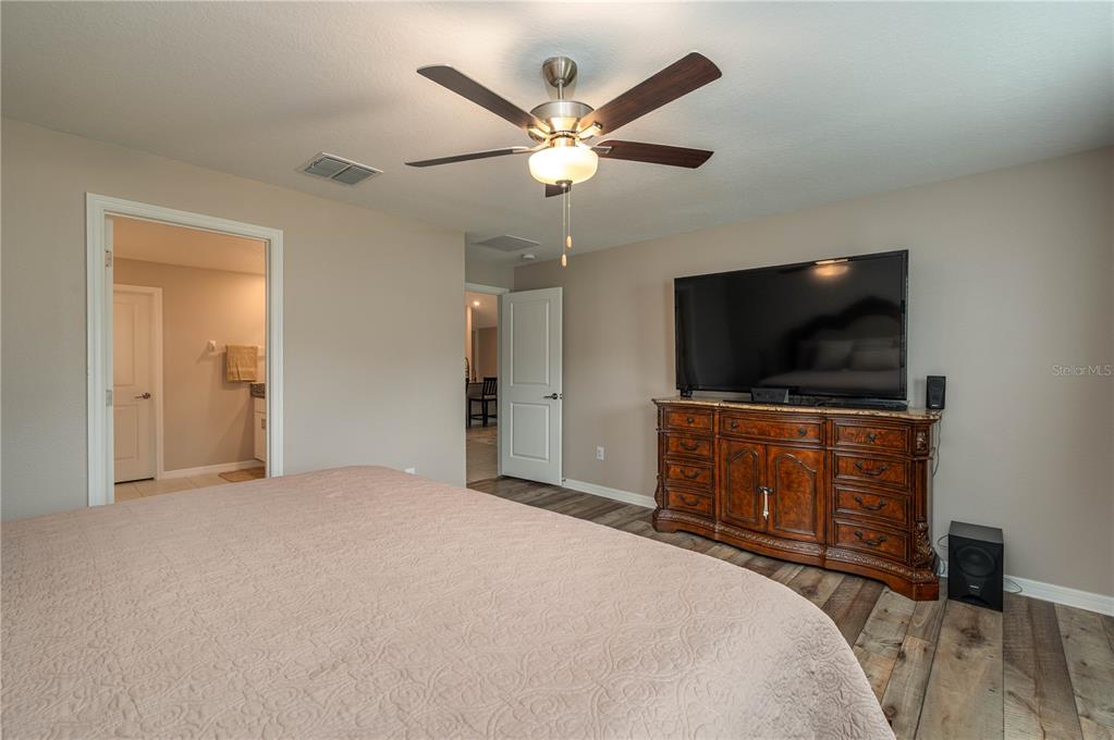 2958 Flying Blackbird Road Bartow, FL 33830 - Photo 13 of 28 a bedroom with a bed and a flat screen tv