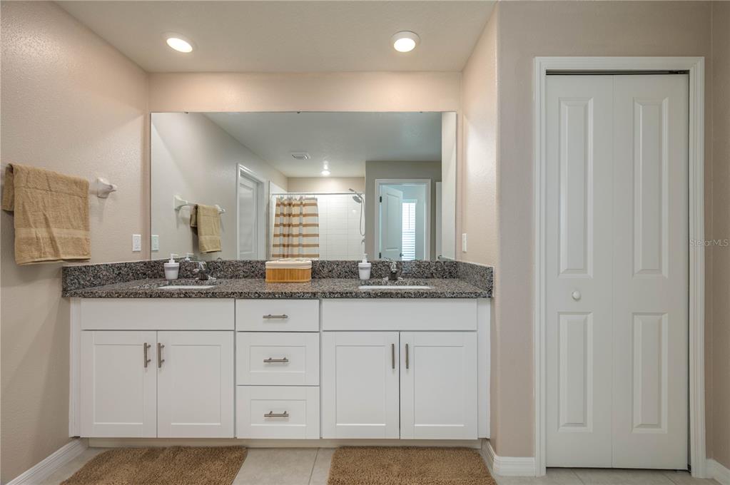 2958 Flying Blackbird Road Bartow, FL 33830 - Photo 15 of 28 a bathroom with a granite countertop sink and a mirror