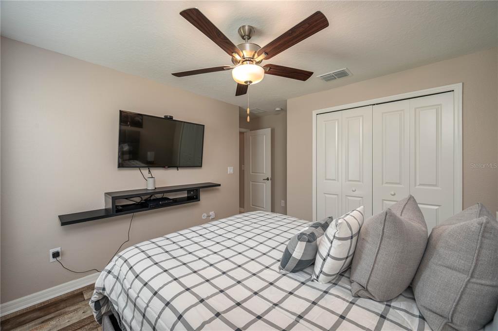 2958 Flying Blackbird Road Bartow, FL 33830 - Photo 18 of 28 a bedroom with a bed and a flat screen tv